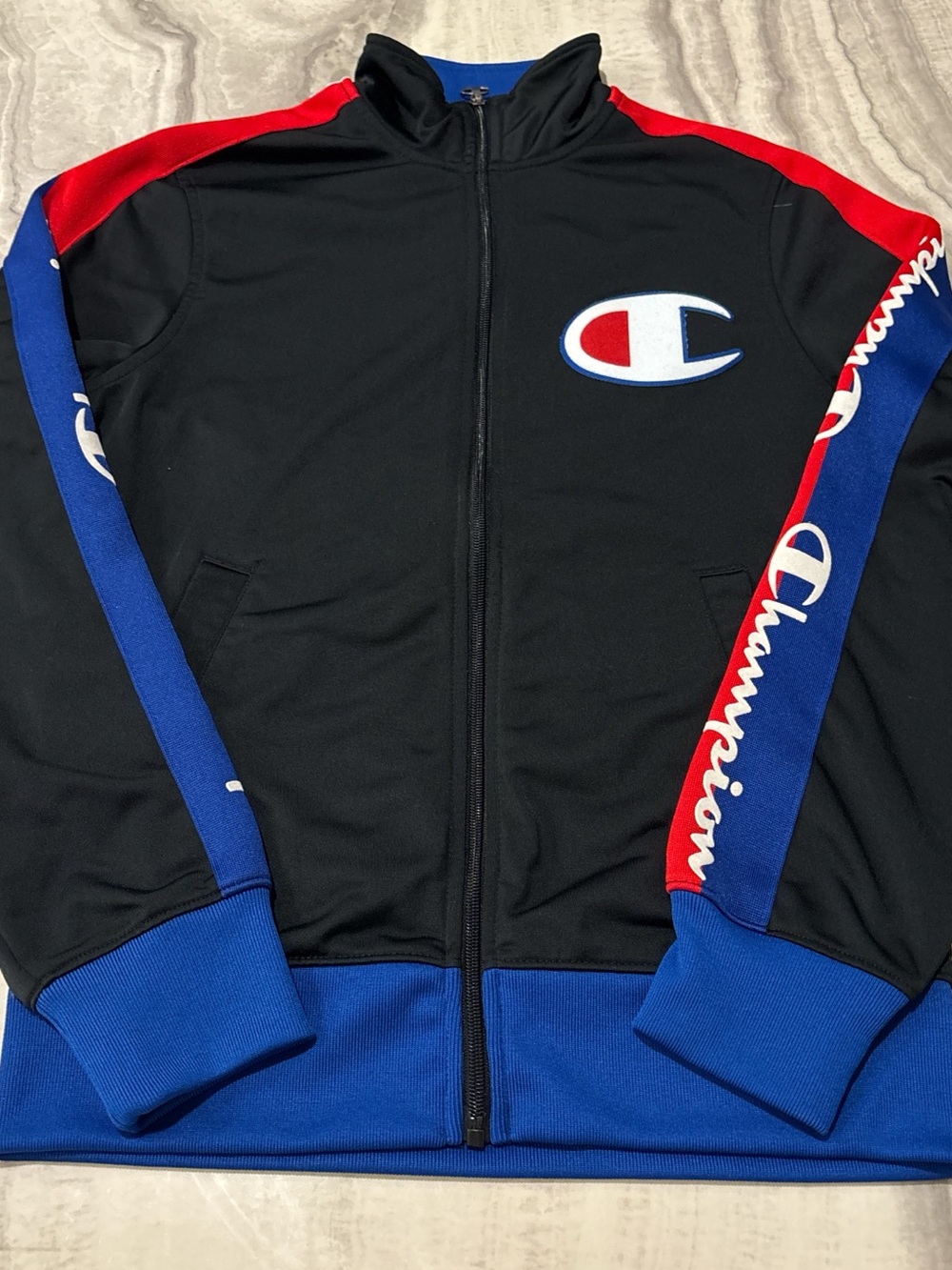 Champion Blue and Black Hoodie Tag Detail